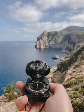 Close up view of compass in hand