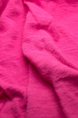 This is a photograph of textured Pink fabric
