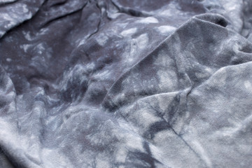 This is a photograph of textured Tie dye fabric background