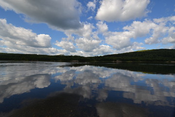 Fototapeta premium the sky is reflected in the river or the river is reflected in the sky