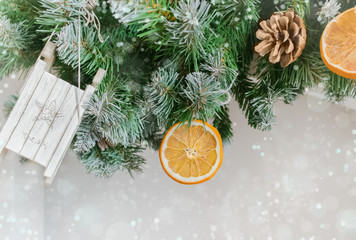 Christmas garland of Christmas tree branches, toys, dried oranges, cones on a white background.Trappings.instruction.Christmas background, texture.Christmas morning.Postcard. copy space