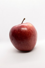This is a photograph of a Red Apple isolated on a White background