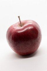 This is a photograph of a Red Apple isolated on a White background
