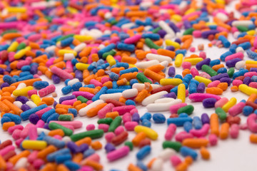 Fototapeta na wymiar This is a photograph of colorful sprinkles isolated on a White background