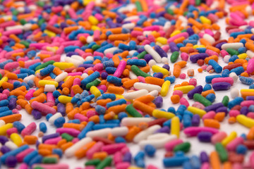 This is a photograph of colorful sprinkles isolated on a White background