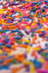 This is a photograph of colorful sprinkles isolated on a White background