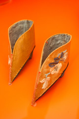 orange asian shoes for lotus feet