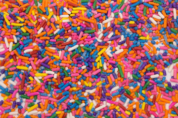 This is a photograph of colorful sprinkles isolated on a White background