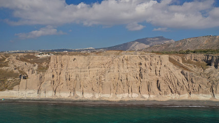 Aerial drone photo of amazing shape giant volcanic rock formations in Vlychada beach, Santorini island, Cyclades, Greece