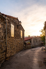 Fototapeta na wymiar Empty street in a medieval village at sunset