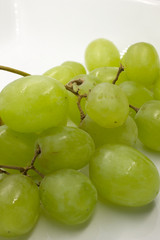 This is a photograph of Green Grapes isolated on a White background