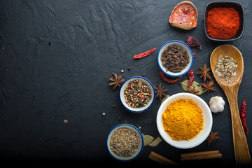spices with ingredients on dark background. healthy or cooking concept, asian food