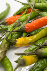 This is a photograph of Thai Chili peppers isolated on a White background