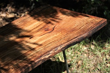 milled wooden slab in the oak shadows
