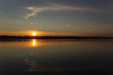 Fototapeta na wymiar Sunset over a lake