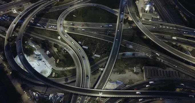 Aerial view of modern city highway grade separation in night lights