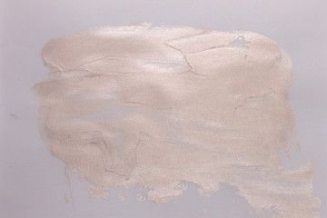This is a photograph of a Pearly Pink liquid highlighter swatch isolated on a White background