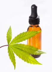 bottle of oil with leaves and flowers