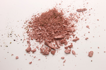 This is a photograph of a Pearly Pink powder eyeshadow isolated on a White background
