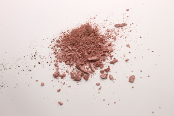 This is a photograph of a Pearly Pink powder eyeshadow isolated on a White background