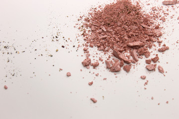 This is a photograph of a Pearly Pink powder eyeshadow isolated on a White background