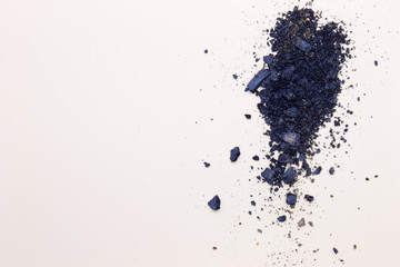 This is a photograph of Shimmery Royal Blue powder Eyeshadow isolated on a White background