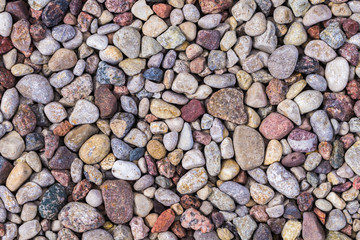 Background from many stones of different shapes, sizes, colors