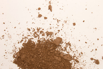 This is a photograph of a Bronzer powder makeup isolated on a White background