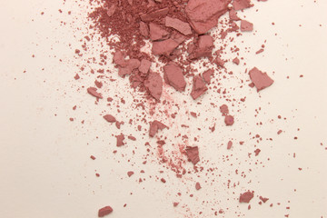 This is a photograph of Rose Pink powder Blusher isolated on a White background