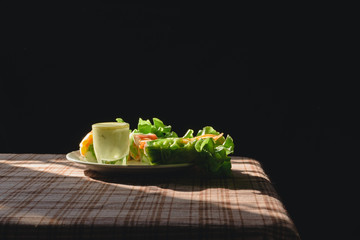 Fresh vegetable spring roll, clean food, salad for weight loss, on table in kitchen with morning sun light by window, Popular food among health lovers With vitamins and fiber that are easily digested.