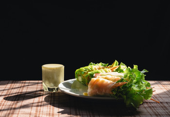 Fresh vegetable spring roll, clean food, salad for weight loss, on table in kitchen with morning sun light by window, Popular food among health lovers With vitamins and fiber that are easily digested.