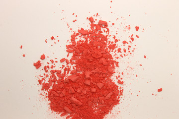 This is a photograph of Orange powder Blusher isolated on a White background
