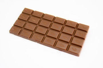 Milk chocolate tablet with cocoa symbol on the surface of each tablet