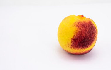 Ripe peach of the Mediterranean basin of orange, yellow and reddish colors, ready for consumption