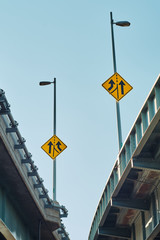 Yellow directional signs at crossroads