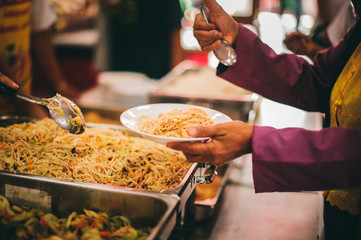 Food donated to hungry people homeless, Free food to beggars : concept of giving