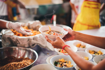 Food donated to hungry people homeless, Free food to beggars : concept of giving