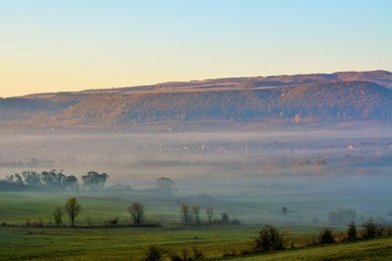 fog in the valleys over the village