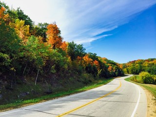 View looking down a country road in the fall/autumn in the Midwest
