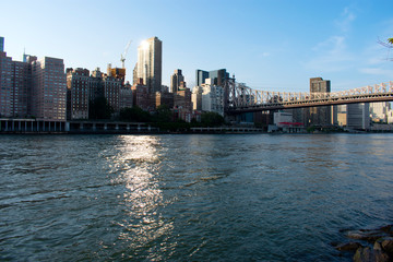 Fototapeta na wymiar Skyline view of Manhattan, New York City skyline, from the East River's Roosevelt Island -10