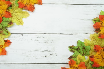 Autumn Maple leave border frame with space copy on wooden background