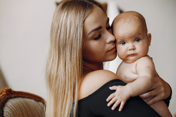 Mother with cute daughter. Blonde with long hair.