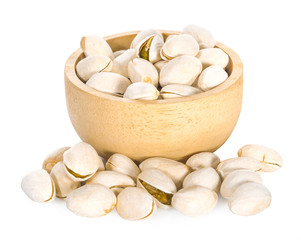 A bowl of pistachios on white background.