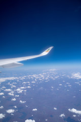 A airplane wing and sky view from window