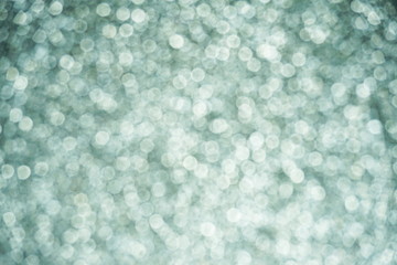 Blurred lights of grey bokeh abstract color background