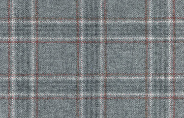Grey Glenurquhart check is made of woolen fabric. Herringbone tweed, Wool Background Texture. Coat close-up. Expensive men's suit