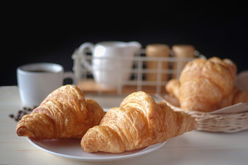 Fresh croissant. Freshly baked croissants with a cup of espresso. Tasty croissants.