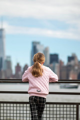 Fototapeta na wymiar Girl looking out on NYC