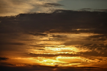 Fototapeta na wymiar Diffuse sunset thru cloudy sky