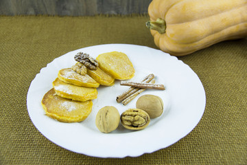 Pumpkin pancakes with walnuts and honey sauce
